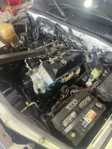Technician working on an automotive electrical system